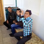 Uzbekistan: Bukhara Local tourists in the courtyard of the Mausoleum of