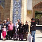 Uzbekistan: Bukhara Family photo outside the Mausoleum of Bahauddin Naqshbandi.