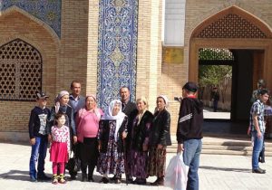 Uzbekistan: Bukhara Family photo outside the Mausoleum of Bahauddin Naqshbandi.