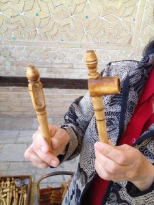 Uzbekistan: Bukhara Our guide showing us two 'pee pipes' for babies