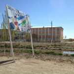 Uzbekistan: Nukus A new school. The sign shows president Karimov with