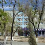 Uzbekistan: Nukus A commercial and residential street with 5-story buildings.