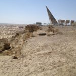 Uzbekistan: Muynak Aral Sea dry bed with rusting boats and monument.