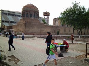 Uzbekistan: Fergana City old market dome with new buildings behind.