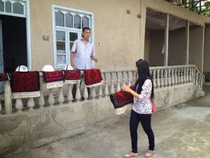 Uzbekistan: Fergana Valley, Rishton The Bahrom family weavers sell small carpets