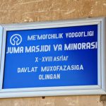 Uzbekistan: Khiva sign for Juma mosque and minaret.