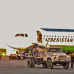 Uzbekistan: Nukus Unloading the inbound flight baggage with an old Russian