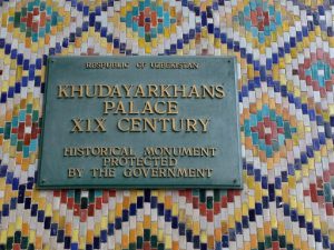Uzbekistan: Kokand City Name sign and close-up of mosaic tiles.