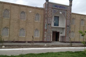 Uzbekistan: Kokand City Highly decorated mosaic tile entry to a building.