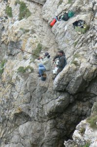 Portugal, Sagres Town: fishermen on steep cliffs