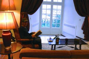 Portugal, Estremoz: Michael reading in lobby of pousada