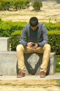 Portugal, Porto City: close-up cell phone guy