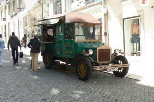 Portugal, Lisbon: antique car kiosk selling cookies