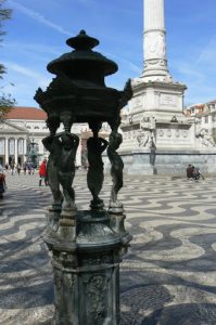 Portugal, Lisbon: water fountain and  decorative cobblestone plaza