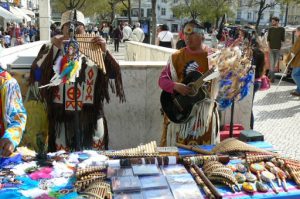 Portugal, Lisbon: Peruvian pan flute musicians playing and selling music