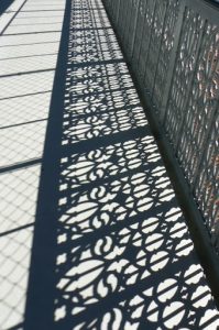 Portugal, Lisbon: bridge railing shadow