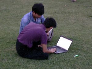 Burma, Rangoon: Mahabandoola Garden; two students