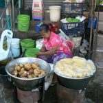 Burma, Rangoon: street vendor selling turnips and corn
