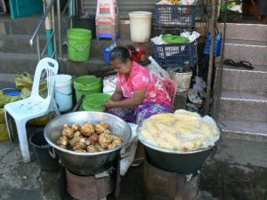 Burma, Rangoon: street vendor selling turnips and corn