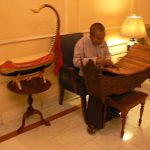 Burma, Rangoon; Gamelan musician in Strand Hotel