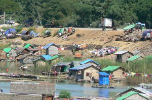 Burma, Mandalay: local village houses made of rattan with fiberglass tarps