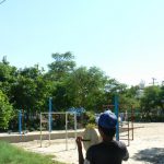 Burma, Mandalay: boy flying his kite