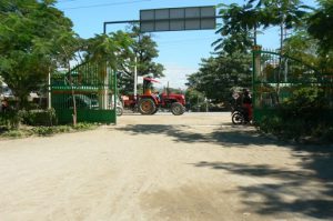 Burma, Mandalay: local road with new tractor