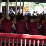 Monks eating breakfast;  each one carries and washes his own