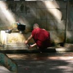Burma, Mandalay  Maha Ganayon Kyaung Monastery; washing his eating bowl