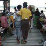 Burma: Mandalay: U Bein Bridge; wood plank floor; local friends with