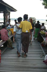 Burma: Mandalay: U Bein Bridge; wood plank floor; local friends with