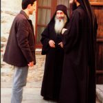 Greece: Mount Athos: monks and visitor at Simonpeter monastery